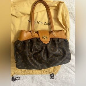 Louis Vuitton Boetie MM Monogram hand bag.